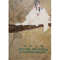 Dotting the eyes on a painted dragon